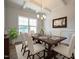 Elegant dining room featuring coffered ceilings, wainscoting, and a stylish chandelier at 236 Johnson Ridge Way, Four Oaks, NC 27524