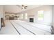 Spacious living room with fireplace and large windows, ready for personalization at 236 Johnson Ridge Way, Four Oaks, NC 27524
