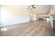 Bright and airy living room open to the kitchen, featuring hardwood floors and natural light at 236 Johnson Ridge Way, Four Oaks, NC 27524