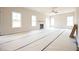 Open-concept living room showcasing a fireplace, awaiting personal touches and décor at 236 Johnson Ridge Way, Four Oaks, NC 27524
