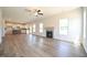 Open concept living space with fireplace, kitchen, and abundant windows for natural light at 236 Johnson Ridge Way, Four Oaks, NC 27524