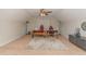 Finished attic space featuring multiple desks, red gaming chairs, and carpeting at 2407 Cattail Pond Dr, Zebulon, NC 27597