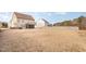 Large backyard featuring a screened porch, offering an abundance of space for recreation and outdoor activities at 2407 Cattail Pond Dr, Zebulon, NC 27597