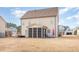 Spacious backyard with a screened porch, ideal for outdoor entertaining and relaxation in a serene setting at 2407 Cattail Pond Dr, Zebulon, NC 27597