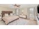 Spacious bedroom with a king-size bed and ceiling fan at 2407 Cattail Pond Dr, Zebulon, NC 27597