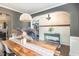Spacious dining room with wood table, statement lighting, and open floor plan at 2407 Cattail Pond Dr, Zebulon, NC 27597