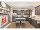 Modern kitchen with granite counters, stainless steel appliances, and a center island with seating at 2407 Cattail Pond Dr, Zebulon, NC 27597