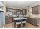 Modern kitchen with granite counters, stainless steel appliances, and a center island with seating at 2407 Cattail Pond Dr, Zebulon, NC 27597