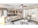 Living room with sectional sofa, fireplace, and view into kitchen area at 2407 Cattail Pond Dr, Zebulon, NC 27597