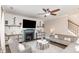 Living room with fireplace, built-in shelving and large windows at 2407 Cattail Pond Dr, Zebulon, NC 27597