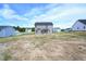 The back of this two-story home is gray with a black roof at 247 Johnson Ridge Way, Four Oaks, NC 27524