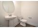 Powder bathroom with pedestal sink and modern fixtures at 247 Johnson Ridge Way, Four Oaks, NC 27524
