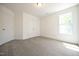 This carpeted bedroom features a window and double closets at 247 Johnson Ridge Way, Four Oaks, NC 27524