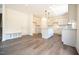 Bright and spacious kitchen features a large island, modern cabinetry, and a convenient mudroom entrance, perfect for Gathering living at 247 Johnson Ridge Way, Four Oaks, NC 27524