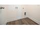 This laundry room has vinyl floors and hookups for a washer and dryer at 247 Johnson Ridge Way, Four Oaks, NC 27524