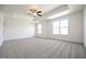 Spacious bedroom with tray ceiling, ceiling fan and large windows at 247 Johnson Ridge Way, Four Oaks, NC 27524