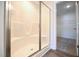Bathroom featuring a walk-in shower and walk-in closet at 247 Johnson Ridge Way, Four Oaks, NC 27524