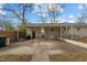 Covered back patio with grill and sitting area at 2522 Hickory Ave, Burlington, NC 27215