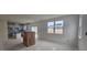 Bright living area with large windows and easy access to the backyard and open kitchen at 253 Windsor Mill Rd, Rolesville, NC 27571
