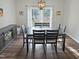 Bright dining room with a large table and backyard views at 2548 Deanwood Dr, Raleigh, NC 27615