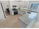 Kitchen with white cabinets, granite countertops, and stainless steel appliances at 2548 Deanwood Dr, Raleigh, NC 27615