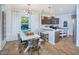 Eat-in kitchen with island, hardwood floors, and modern cabinetry at 2904 Huxley Way, Apex, NC 27502