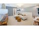 Open loft area with a comfortable sofa, a workspace, and plenty of natural light at 2916 Huxley Way, Apex, NC 27502