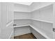 Bright white pantry with ample shelving for storage at 2923 Heirloom Way, Apex, NC 27502