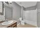 Clean bathroom with tub, toilet and vanity with granite top at 309 Coalyard Dr, Garner, NC 27529