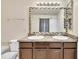 Bathroom with double sinks, granite countertop, and a large mirror at 309 Coalyard Dr, Garner, NC 27529