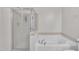 Bathroom featuring a shower and a large garden tub at 309 Coalyard Dr, Garner, NC 27529