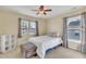 Cozy bedroom with double bed, window, and built-in shelving at 309 Coalyard Dr, Garner, NC 27529