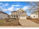 Two-story house with a neutral color scheme and a two-car garage at 309 Coalyard Dr, Garner, NC 27529