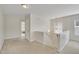 Upstairs hallway with neutral carpeting and light walls at 309 Coalyard Dr, Garner, NC 27529