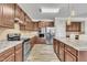 Modern kitchen with stainless steel appliances and granite countertops at 309 Coalyard Dr, Garner, NC 27529