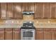 Kitchen with stainless steel appliances and wood cabinets at 309 Coalyard Dr, Garner, NC 27529
