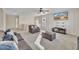 Bright living room with large windows and a cozy seating area at 309 Coalyard Dr, Garner, NC 27529