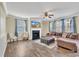 Living room with hardwood floors, fireplace, and ample natural light at 309 Coalyard Dr, Garner, NC 27529