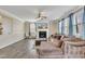 Bright living room featuring hardwood floors and fireplace at 309 Coalyard Dr, Garner, NC 27529