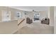Bright living room with large windows and a cozy seating area at 309 Coalyard Dr, Garner, NC 27529