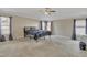 Spacious main bedroom with large windows and ceiling fan at 309 Coalyard Dr, Garner, NC 27529