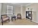 Cozy sitting area with two armchairs and a bookshelf at 309 Coalyard Dr, Garner, NC 27529