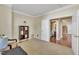Bright sitting room with access to a half bathroom and stairs at 309 Coalyard Dr, Garner, NC 27529
