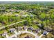 Aerial view of a neighborhood with manicured lawns and tree-lined streets at 347 Country Mill Way, Fuquay Varina, NC 27526