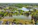 Aerial view of homes near a scenic lake and lush green areas at 347 Country Mill Way, Fuquay Varina, NC 27526