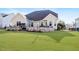 Spacious backyard featuring a stone patio, perfect for outdoor entertaining and relaxation at 347 Country Mill Way, Fuquay Varina, NC 27526