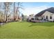Spacious, fully fenced backyard offering privacy and plenty of room for recreation and gardening at 347 Country Mill Way, Fuquay Varina, NC 27526