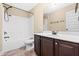 Bathroom featuring vanity with dark wood cabinets and a bathtub-shower combo at 347 Country Mill Way, Fuquay Varina, NC 27526