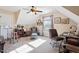 Bedroom featuring neutral walls, carpet, ceiling fan and a sitting area with a fireplace at 347 Country Mill Way, Fuquay Varina, NC 27526
