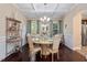Elegant dining room with coffered ceilings, wainscoting, hardwood floors, and a stylish chandelier at 347 Country Mill Way, Fuquay Varina, NC 27526